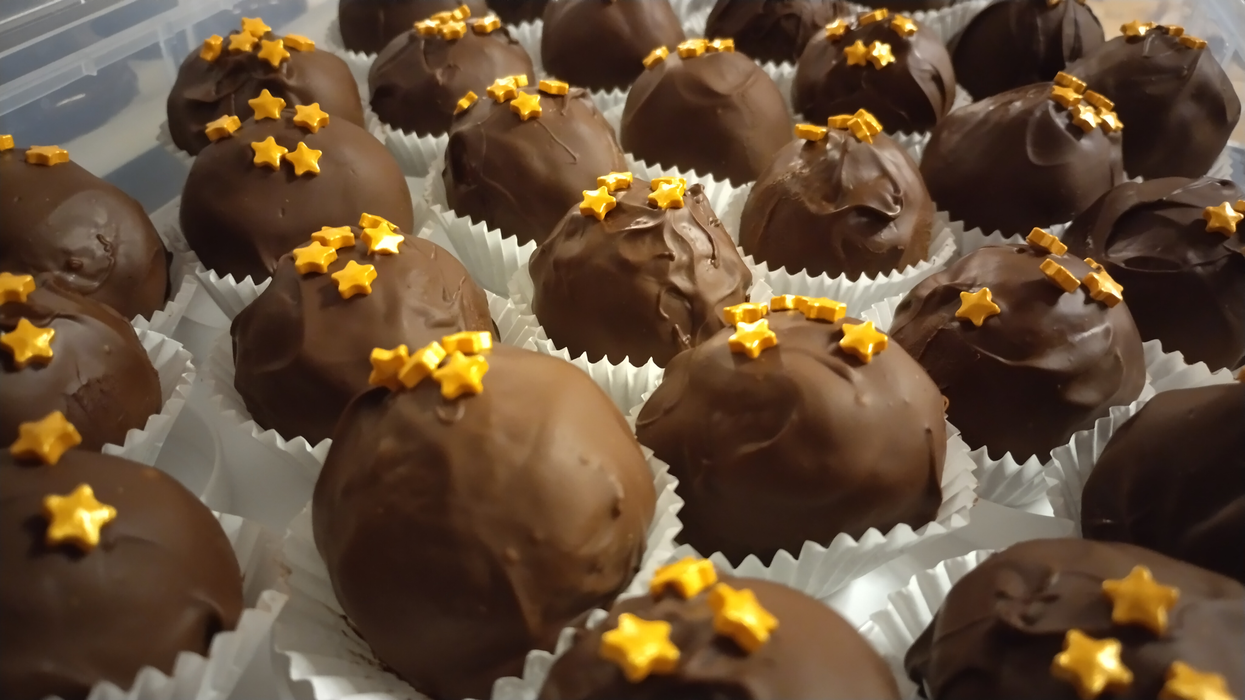 Festive bonbons with chocolate cover and star details